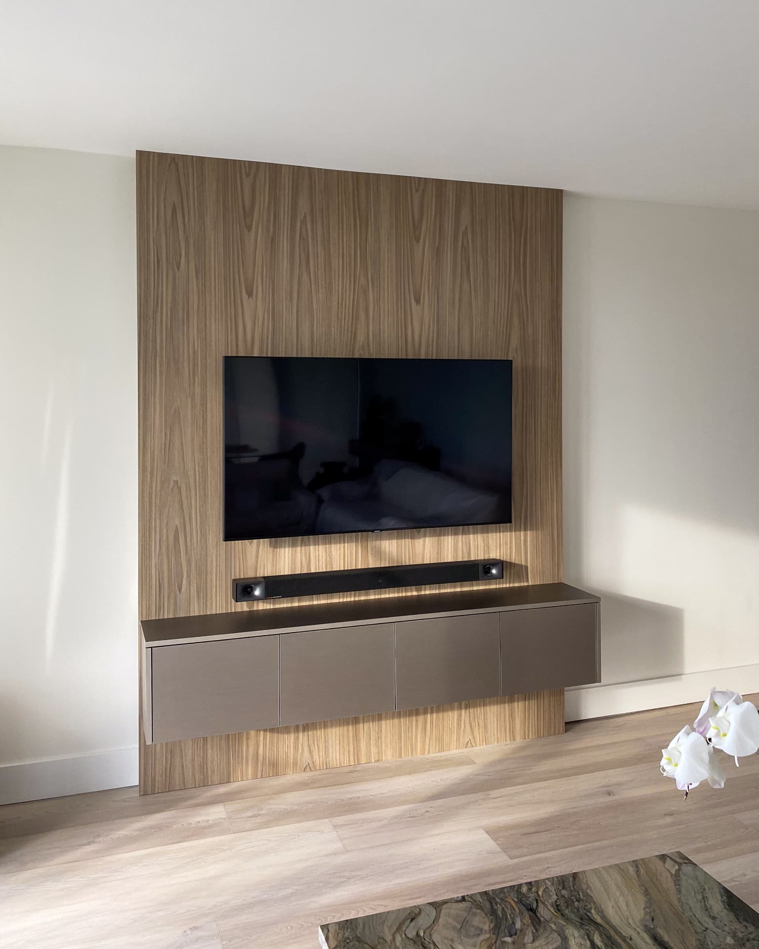 Walnut TV wall with floating cabinet